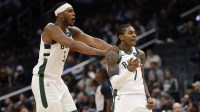 Milwaukee Bucks guard Kevin Porter Jr. (7) celebrates with Bucks center Myles Turner (3) after a three point field goal against the Washington Wizards in the third quarter at Capital One Arena.