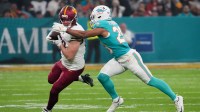 Nov 16, 2025; Madrid, Spain; Washington Commanders tight end Colson Yankoff (80) carries the ball defended by Miami Dolphins safety Minkah Fitzpatrick (29) in the first quarterduring the 2025 NFL Madrid Game at Santiago Bernabeu Stadium.