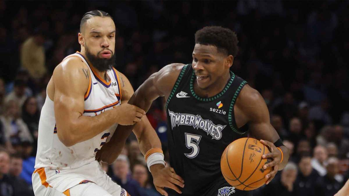 Minnesota Timberwolves guard Anthony Edwards (5) works around Phoenix Suns forward Dillon Brooks (3) in the third quarter at Target Center.