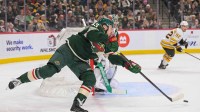 Minnesota Wild defensemen Quinn Hughes (43) makes a pass against the Boston Bruins during the first period at Grand Casino Arena