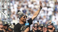 Dodgers shortstop Mookie Betts waves to the crowd during the 2025 World Series championship celebration at Dodger Stadium in Los Angeles on Monday, Nov. 3, 2025.