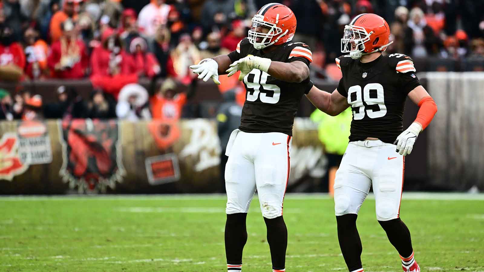 Cleveland Browns defensive end Myles Garrett (95) and Cleveland Browns defensive end Cameron Thomas (99) celebrate after a play during the second half against the San Francisco 49ers at Huntington Bank Field.