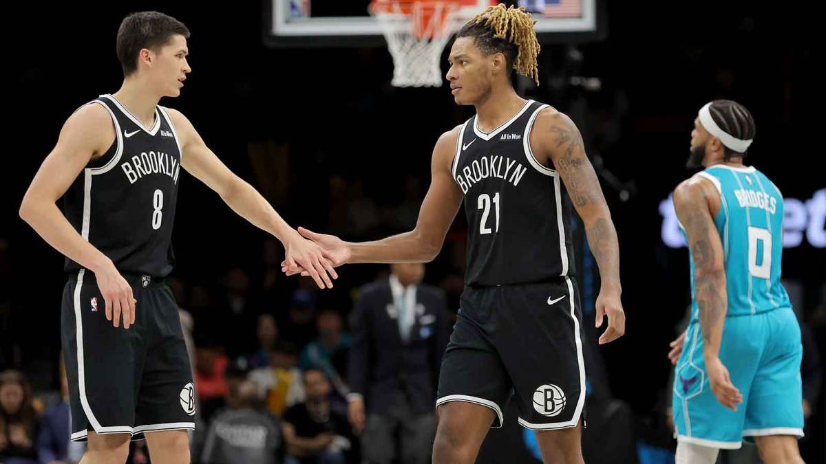 Brooklyn Nets guard Egor Demin (8) high fives forward Noah Clowney (21) in front of Charlotte Hornets forward Miles Bridges (0) during the third quarter at Barclays Center.