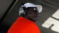 Aug 10, 2025; Watkins Glen, New York, USA; NASCAR Cup Series owner Michael Jordan looks on from atop his team’s pit box during the Go Bowling at The Glen at Watkins Glen International. Mandatory Credit: Matthew O'Haren-Imagn Images