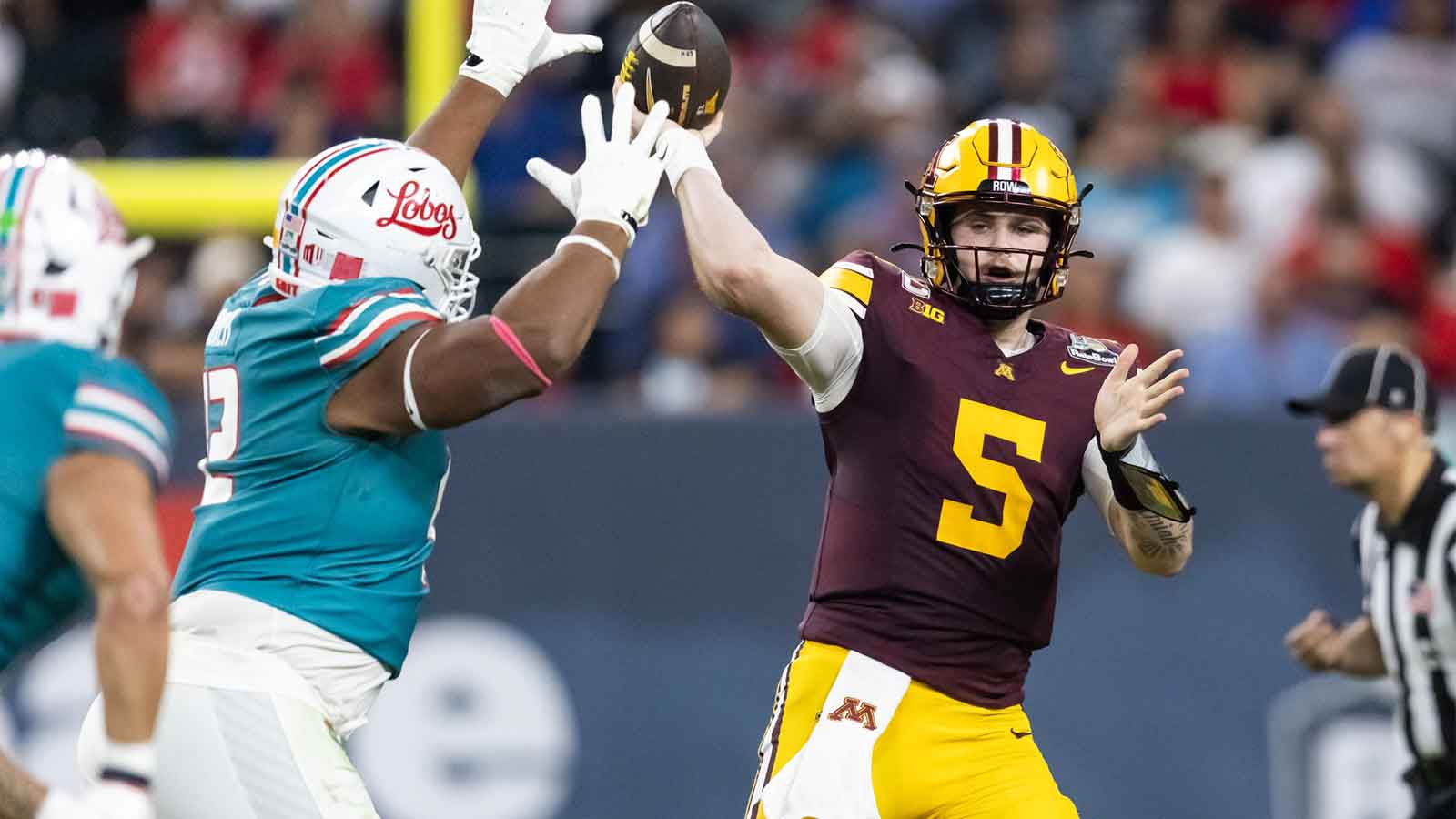 Minnesota Gophers quarterback Drake Lindsey (5) against the New Mexico Lobos during the second half of the Rate Bowl at Chase Field.