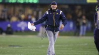 West Virginia Mountaineers head coach Neal Brown argues a call during the fourth quarter against the UCF Knights at Mountaineer Field at Milan Puskar Stadium.