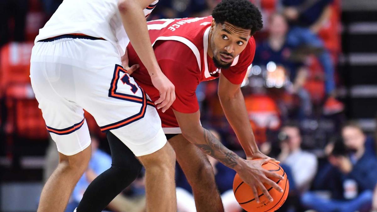 Nebraska Cornhuskers guard Jamarques Lawrence (10) looks around Illinois Fighting Illini guard Keaton Wagler (23) during the second half at State Farm Center.
