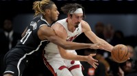 Miami Heat forward Jaime Jaquez Jr. (11) controls the ball against Brooklyn Nets forward Noah Clowney (21) during the second quarter at Barclays Center.