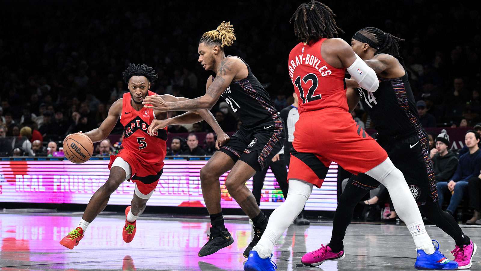 Toronto Raptors guard Immanuel Quickley (5) tries to drive past Brooklyn Nets forward/center Noah Clowney (21) during the second half at Barclays Center.