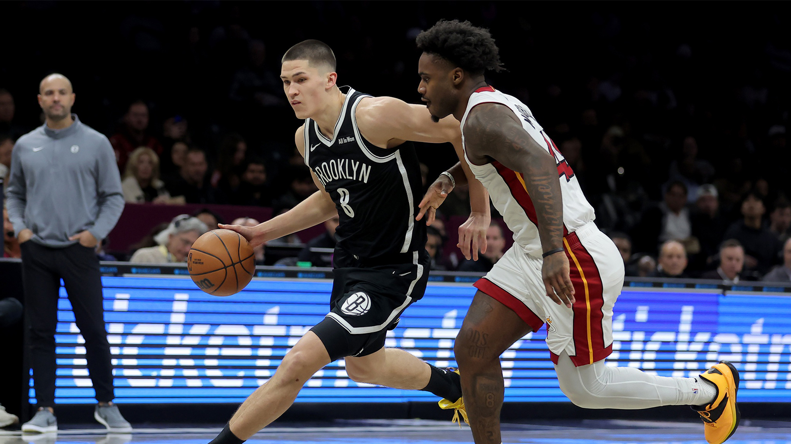 Brooklyn Nets guard Egor Demin (8) drives to the basket against Miami Heat guard Davion Mitchell (45) during the first quarter at Barclays Center.