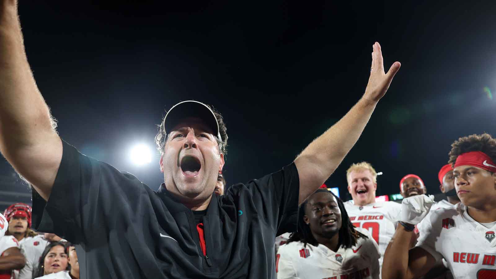 New Mexico Lobos head coach Jason Eck celebrates with his players after defeating the UCLA Bruins 35-10 at the Rose Bowl. 
