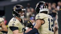 New Orleans Saints wide receiver Chris Olave (12) celebrates a touchdown against the New York Jets with New Orleans Saints quarterback Tyler Shough (6) during the third quarter at Caesars Superdome.