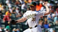 Athletics pitcher Sean Newcomb (31) throws a pitch against the Cincinnati Reds during seventh inning at Sutter Health Park.