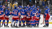 New York Rangers celebrate after they defeated the St. Louis Blues during overtime at Enterprise Center.