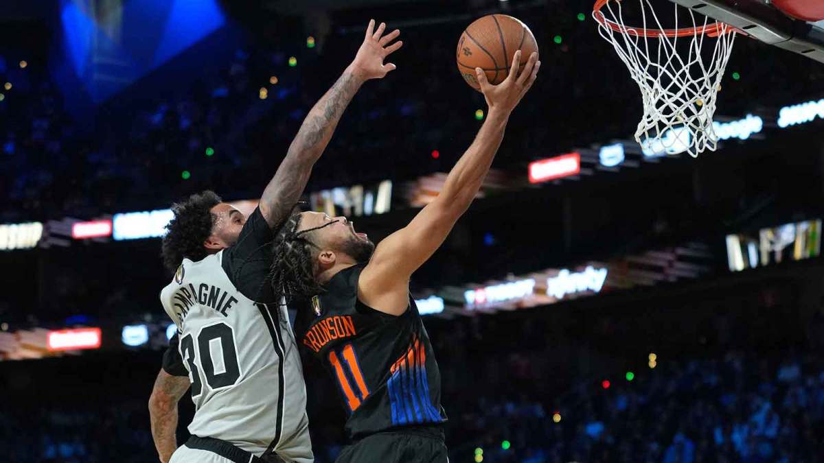 New York Knicks guard Jalen Brunson (11) shoots the ball over San Antonio Spurs forward Julian Champagnie (30) in the second half during the Emirates NBA Cup Final at T-Mobile Arena.