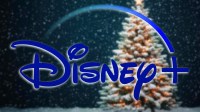 Disney+ logo in front of a Christmas tree.