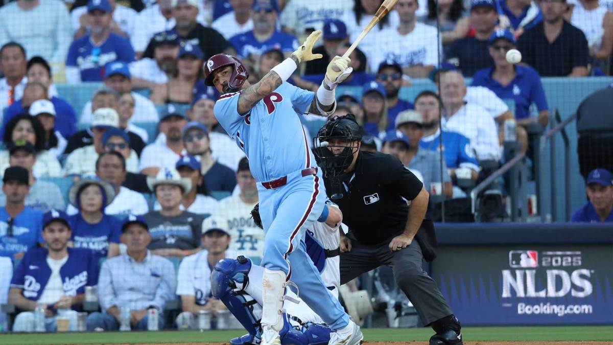 Philadelphia Phillies right fielder Nick Castellanos (8) hits a RBI double in the seventh inning against the Los Angeles Dodgers during game four of the NLDS round for the 2025 MLB playoffs at Dodger Stadium.
