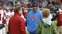 Alabama Crimson Tide head coach Nick Saban (left) and Mississippi Rebels head coach Lane Kiffin (middle) and Knox Kiffen talk prior to the game at Vaught-Hemingway Stadium.