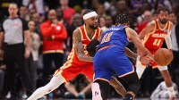 Atlanta Hawks guard Nickeil Alexander-Walker (7) steals the ball from New York Knicks guard Jalen Brunson (11) in the fourth quarter at State Farm Arena.