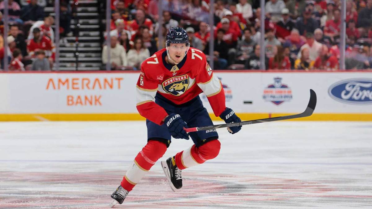 Florida Panthers defenseman Niko Mikkola (77) moves the puck against the Calgary Flames during the first period at Amerant Bank Arena.