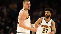 Denver Nuggets center Nikola Jokic (15) and guard Jamal Murray (27) against the Phoenix Suns at the Mortgage Matchup Center.