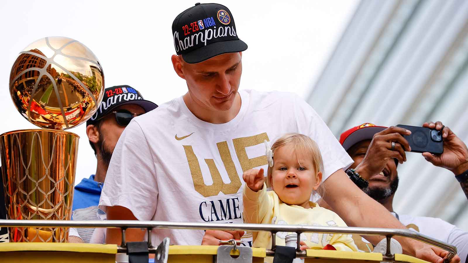 Denver Nuggets center Nikola Jokic (15) with his daughter Ognjena during the championship parade after the Denver Nuggets won the 2023 NBA Finals.