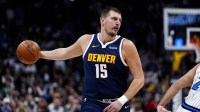 Denver Nuggets center Nikola Jokic (15) prepares to pass the ball in the first quarter against the Orlando Magic at Ball Arena.