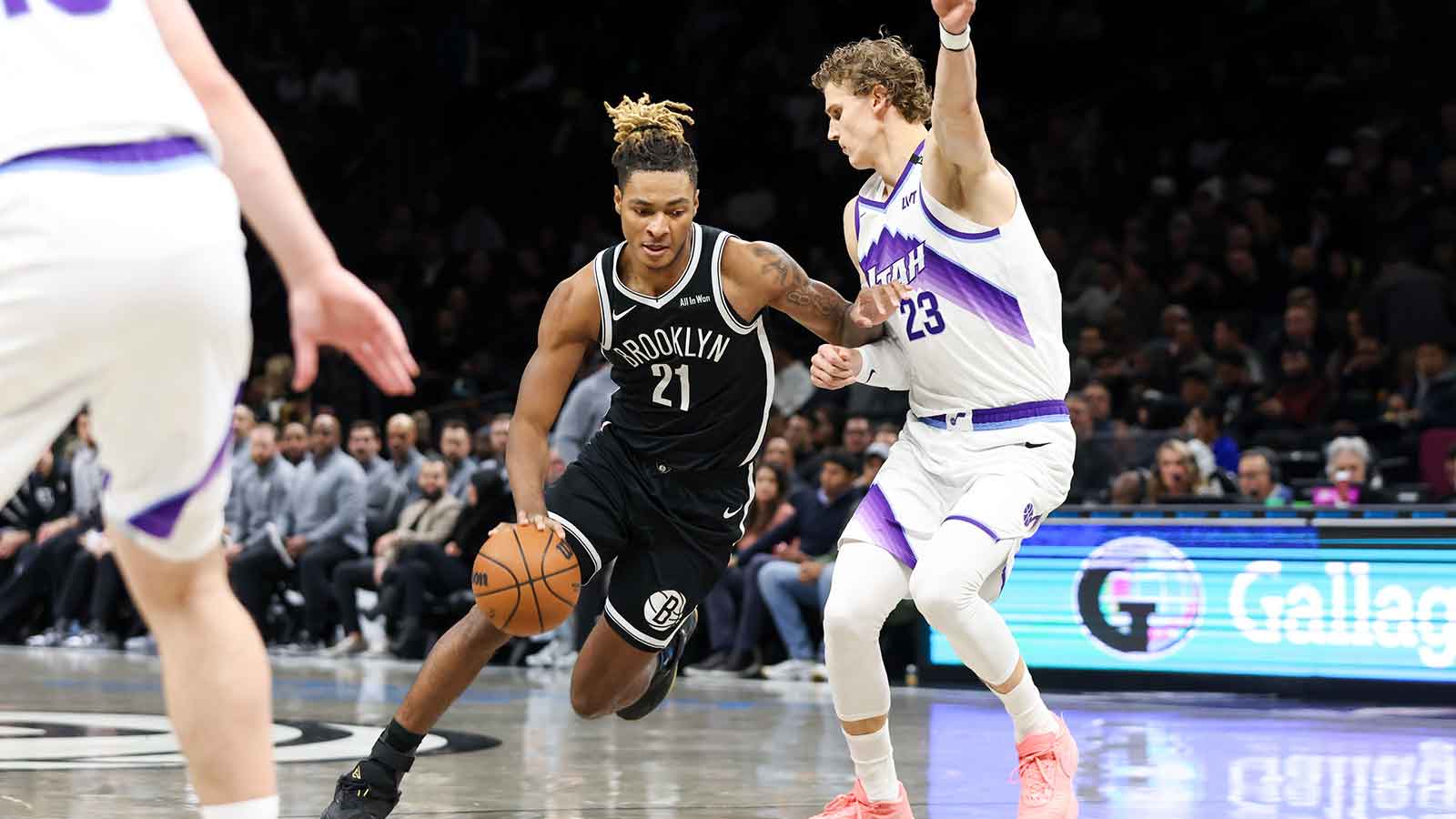 Brooklyn Nets forward Noah Clowney (21) moves the ball past Utah Jazz forward Lauri Markkanen (23) during the first quarter at Barclays Center.