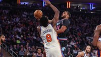 Miami Heat guard Norman Powell (24) drives past New York Knicks forward Og Anunoby (8) in the third quarter at Madison Square Garden.
