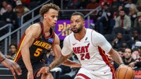 Miami Heat guard Norman Powell (24) dribbles the ball towards the goal against Atlanta Hawks guard Dyson Daniels (5) during the first quarter at State Farm Arena.
