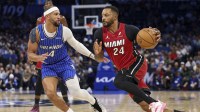 Miami Heat guard Norman Powell (24) drives to the hoop past Orlando Magic guard Jalen Suggs (4) in the first quarter at Kia Center.