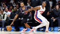 Miami Heat guard Norman Powell (24) dribbles the ball against Detroit Pistons guard Ausar Thompson (9) during the first half at Kaseya Center.