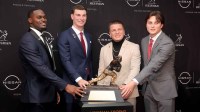 Notre Dame Fighting Irish running back Jeremiyah Love (left to right) and Indiana Hoosiers quarterback Fernando Mendoza and Vanderbilt Commodores quarterback Diego Pavia and Ohio State Buckeyes quarterback Julian Sayin pose with the Heisman trophy during a press conference at the New York Marriott Marquis. Mandatory Credit: Brad Penner-Imagn Images