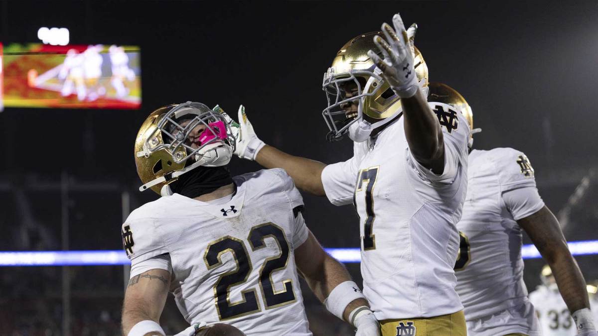 Notre Dame Fighting Irish football team's Aneyas Williams and Ty Washington celebrating a touchdown.