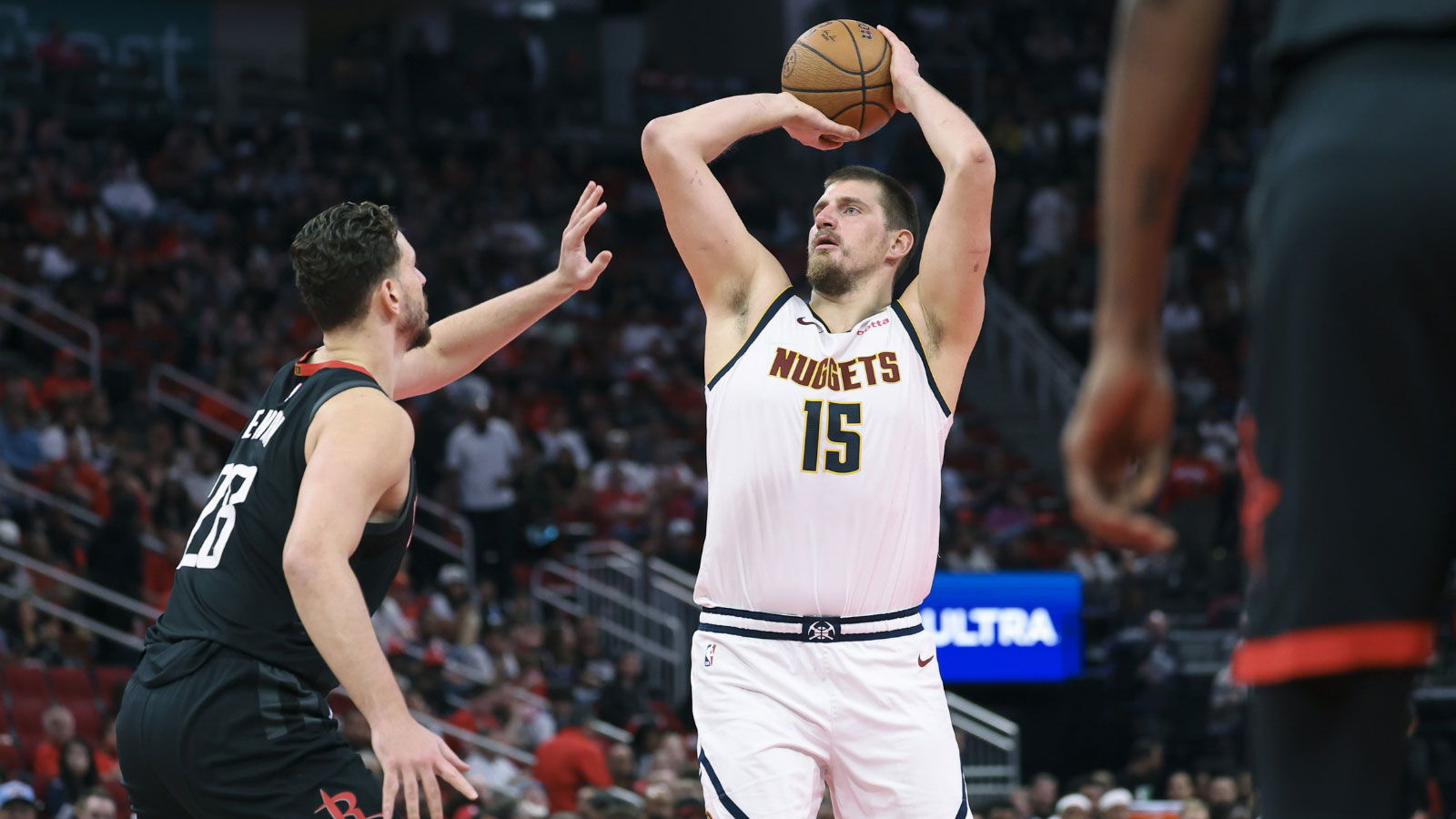 Nuggets center Nikola Jokic (15) shoots the ball as Houston Rockets center Alperen Sengun (28) defends during the third quarter at Toyota Center