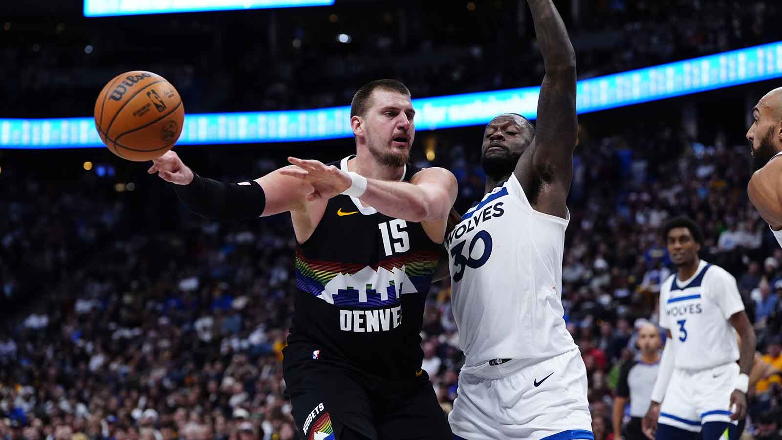 Nuggets center Nikola Jokic (15) comes to the bench in overtime against the Minnesota Timberwolves at Ball Arena