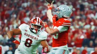 Ohio State Buckeyes quarterback Julian Sayin (10) throws a pass against Indiana Hoosiers defensive lineman Stephen Daley (8) in the first quarter during the 2025 Big Ten championship game at Lucas Oil Stadium.