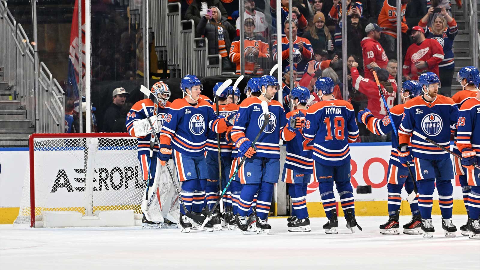 Edmonton Oilers goalie Stuart Skinner (74) and Oilers center Trent Frederic (10) celebrate the win against the Detroit Red Wings during the third period at Rogers Place.