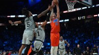 Oklahoma City Thunder center Isaiah Hartenstein (55) grabs the rebound in front of San Antonio Spurs guard Stephon Castle (5) and forward Victor Wembanyama (1) during the second quarter at T-Mobile Arena.