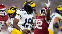 Oklahoma Sooners defensive lineman R Mason Thomas (32) chases after Michigan Wolverines quarterback Bryce Underwood (19) during a college football game between the University of Oklahoma Sooners (OU) and the University of Michigan Wolverines at Gaylord Family Ð Oklahoma Memorial Stadium in Norman, Okla., Saturday, Sept. 6, 2025. Oklahoma won 24-13.