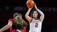 Oklahoma Sooners guard Aaliyah Chavez (2) takes a shot during a women's college basketball game between the University of Oklahoma Sooners (OU) and the NC State Wolfpack.