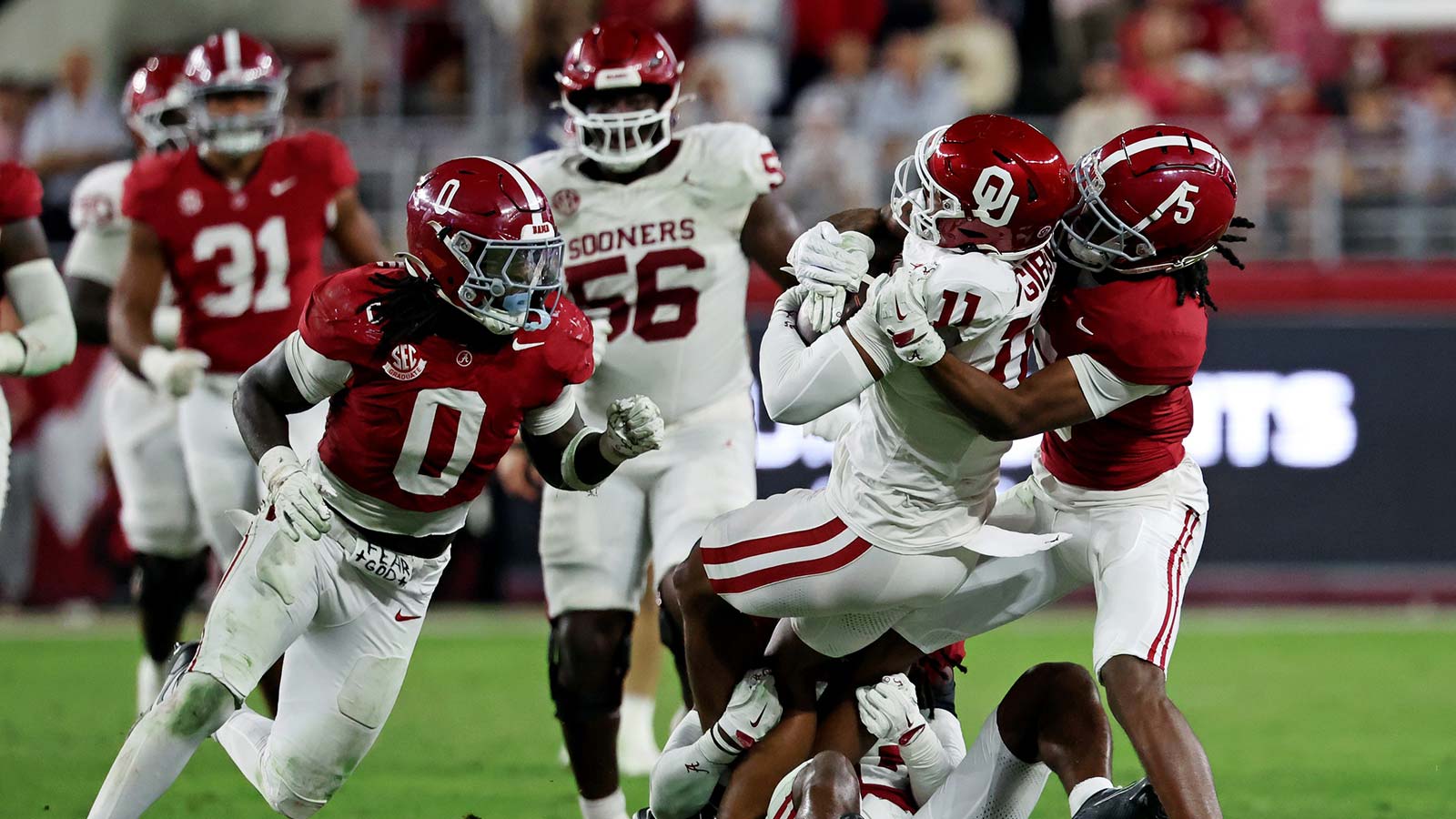 Oklahoma Sooners wide receiver Javonnie Gibson (11) is tackled by Alabama Crimson Tide wide receiver Germie Bernard (5) during the fourth quarter at Saban Field at Bryant-Denny Stadium.