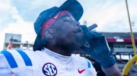 Ole Miss defensive lineman Zxavian Harris (51) smokes a cigar after a college football game between Mississippi State and Ole Miss at Davis Wade Stadium in Starkville, Miss., on Friday, Nov. 28, 2025. Ole Miss defeated Mississippi State 38-19 in the Egg Bowl.