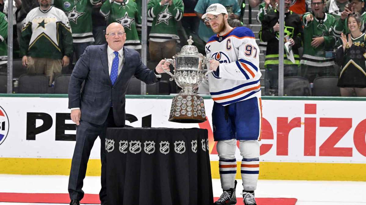 NHL deputy commissioner Bill Daly and Edmonton Oilers center Connor McDavid (97) pose with the trophy after winning the Western Conference Final of the 2025 Stanley Cup Playoffs at American Airlines Center.