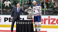 NHL deputy commissioner Bill Daly and Edmonton Oilers center Connor McDavid (97) pose with the trophy after winning the Western Conference Final of the 2025 Stanley Cup Playoffs at American Airlines Center.