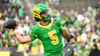 Oregon Ducks quarterback Dante Moore (5) warms up before the game against the James Madison Dukes at Autzen Stadium.