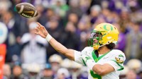 Oregon quarterback Dante Moore throws a pass as the Oregon Ducks take on the Washington Huskies on Nov. 29, 2025, at Husky Stadium in Seattle, Washington.