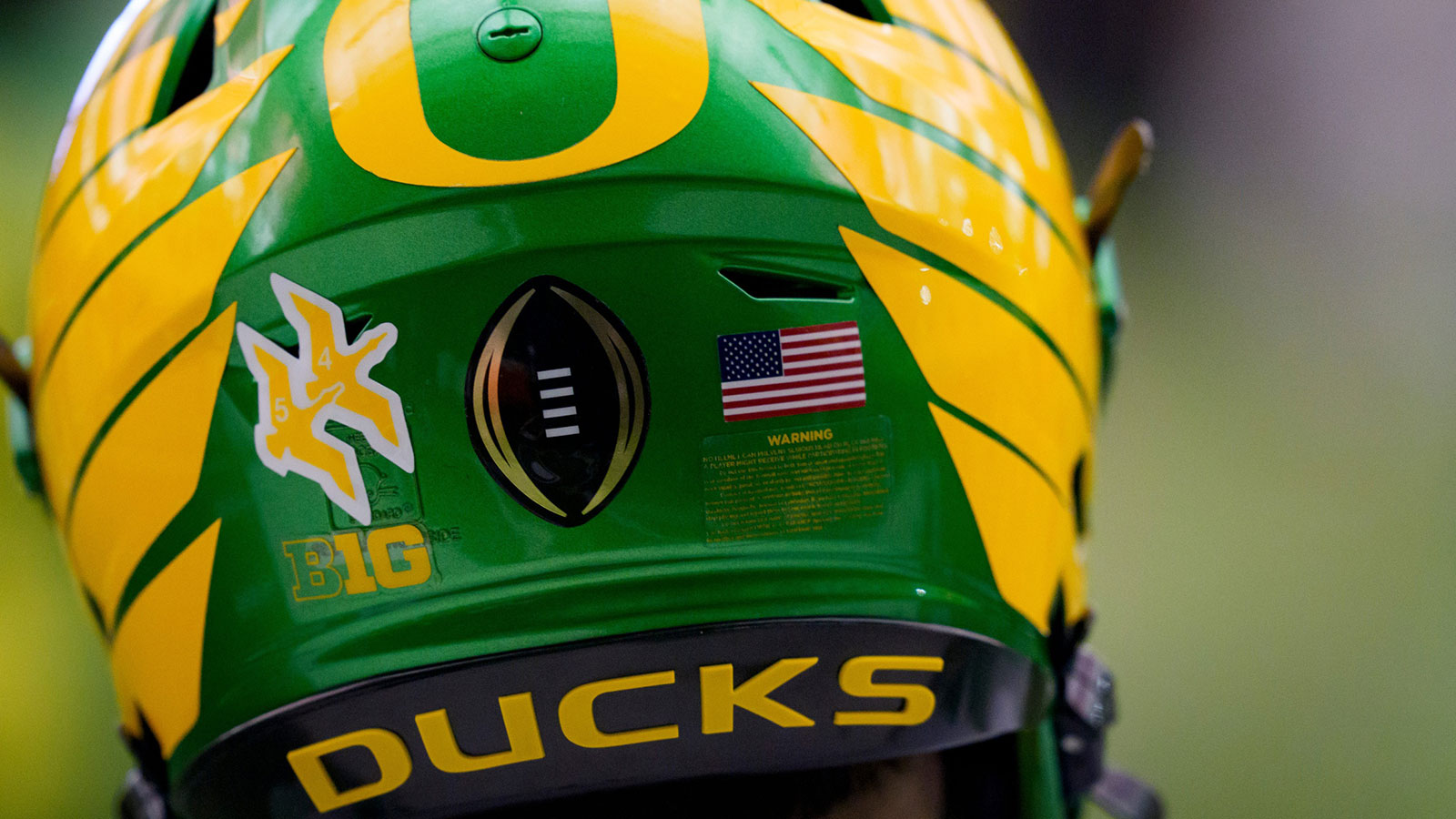 The College Football Playoff logo adorns a helmet during an open practice ahead of the Orange Bowl at the Moshofsky Center in Eugene, Oregon on Dec. 27, 2025.