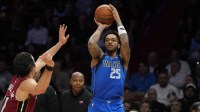 Dallas Mavericks forward P.J. Washington (25) takes a shot over Miami Heat forward Jaime Jaquez Jr. (11) during the second half at Kaseya Center.