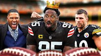 Browns' Myles Garrett with a crown on his head next to Michael Strahan, T.J. Watt